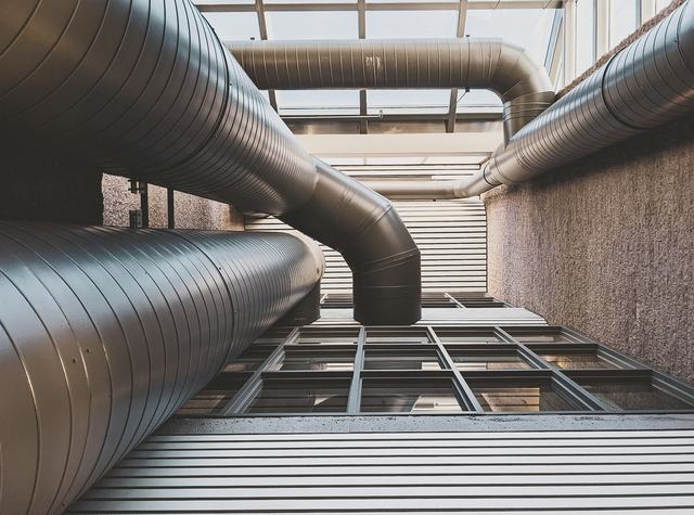 Large ventilation ductwork running through the service void of a building.